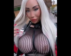 Hot blonde plastic MILF with big fake silicone tits walking in public