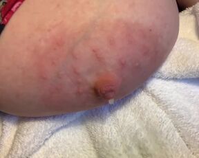 Lactating tit so full during pumping session that it drips