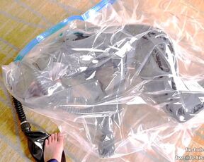 Cute Latex girl on vacuum bag and mask, breathplay