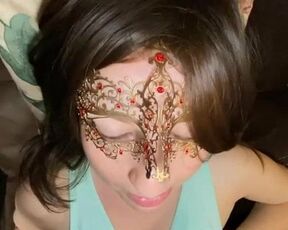 Masked brunette gives clothed titty fucking