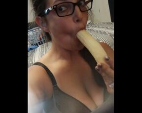 Candy licking and sucking a banana