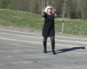 Business lady flashing on the road