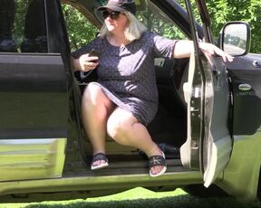 Under the skirt of a mature bbw sitting in a car.