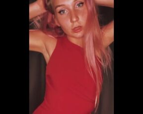 Girl in a sexy red dresss moking a cigarette and dancing